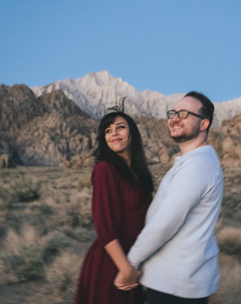 Engaged couple wearing a red dress in the Alabama Hills