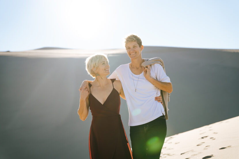 Two brides in the Death Valley Sand dunes, with glowing backlight