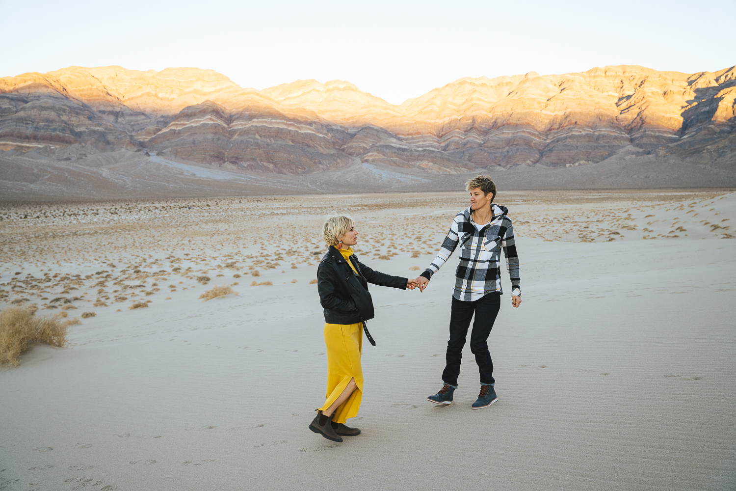 Two brides in the Death Valley Sand dunes, casual yellow dress