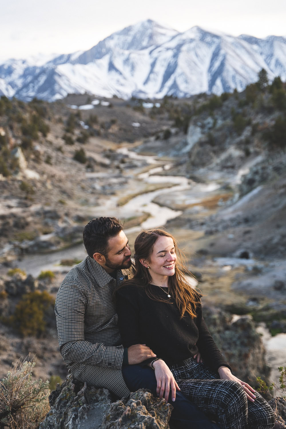 Engaged couple at Hot Creek site near Mammoth Lakes California