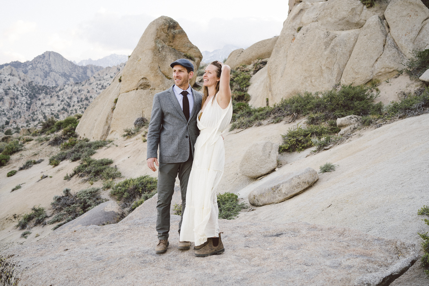 Adventurous wedding couple surrounded by granite boulders