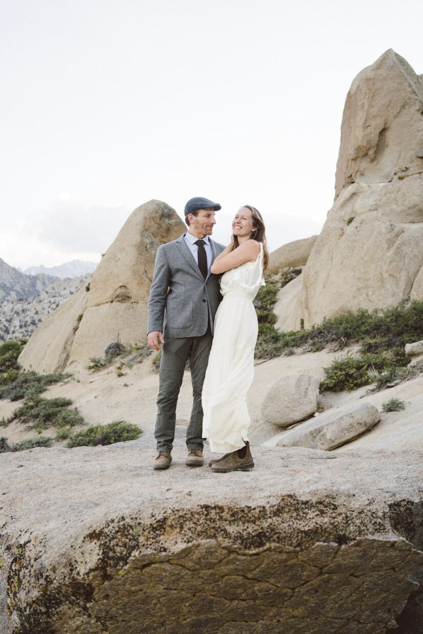 Adventurous wedding couple surrounded by granite boulders