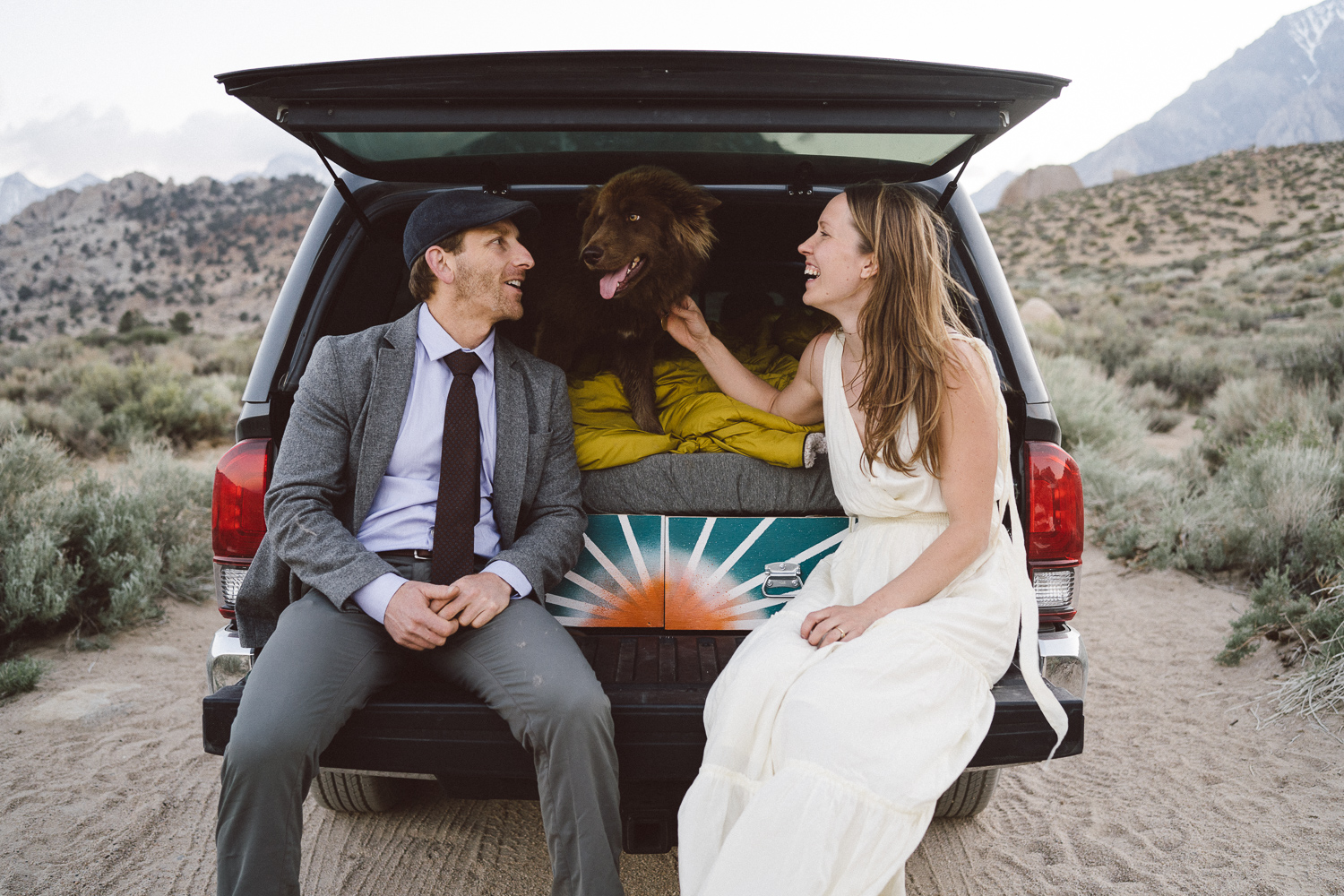 Adventurous wedding couple with dog in their camper truck