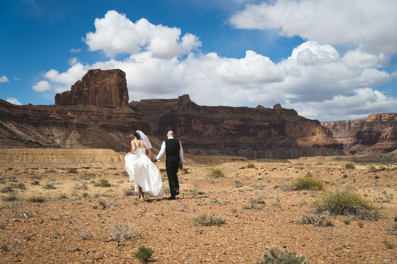 wedding couple explores the San Rafael Swell in Utah