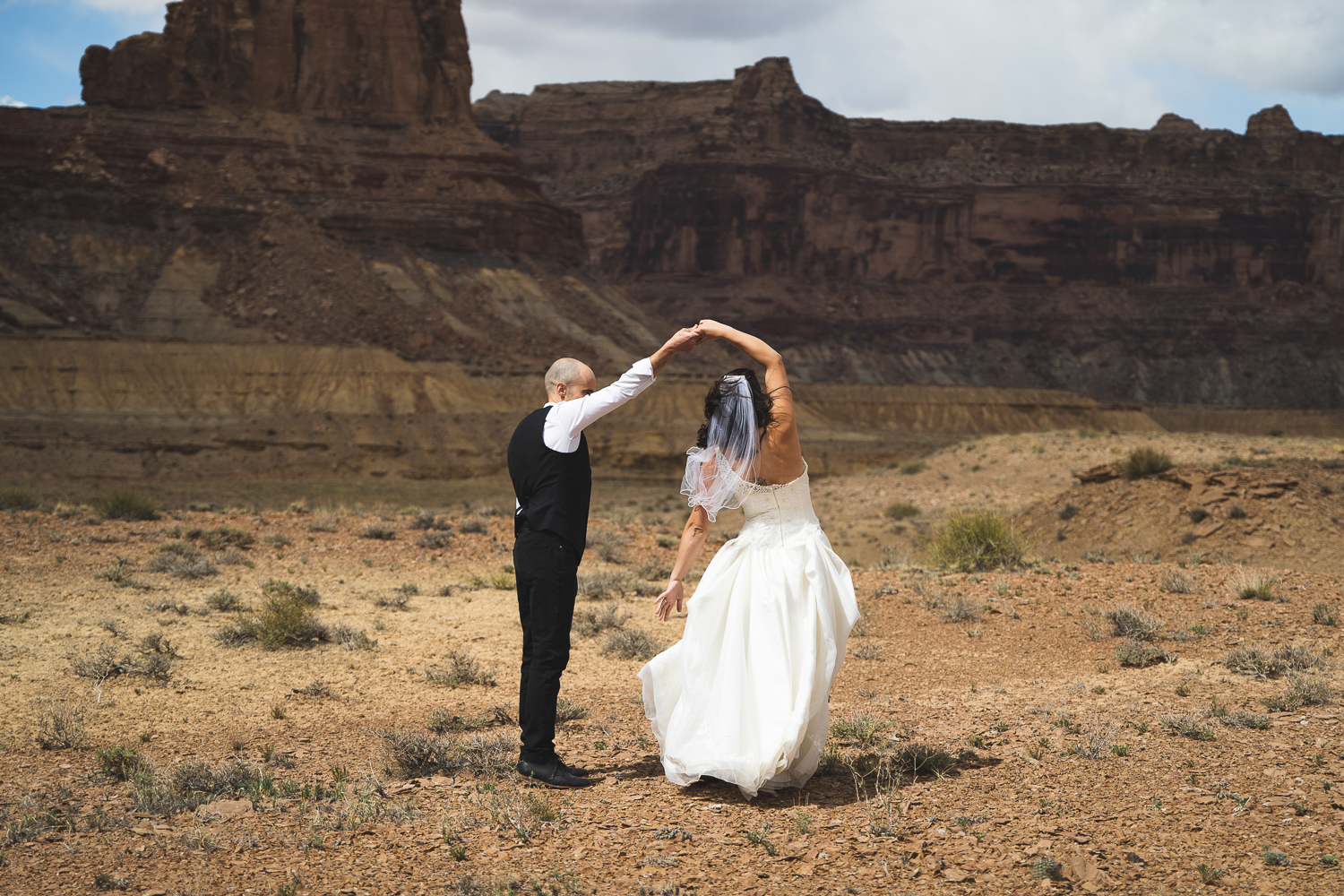 wedding couple dances in the Utah desert